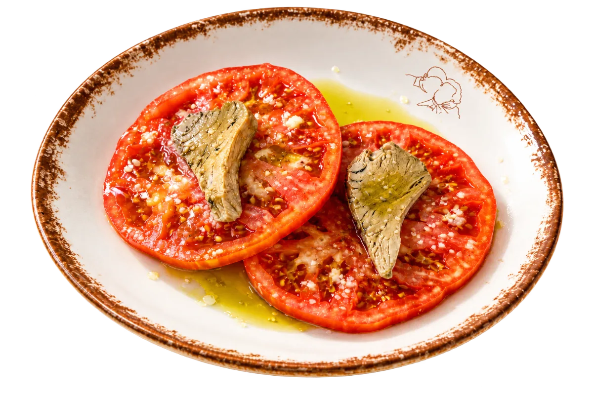 Tomate con alcachofas y aceite de oliva